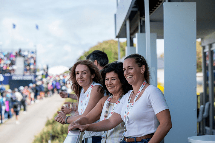 Three women watching the AIG Women's Open 2025 from hospitality at Royal Porthcawl